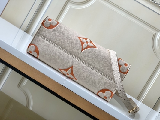 Sahnesafran-riesiges Monogramm OnTheGo Millimeter Louis Vuitton Messenger Bag For Ipad Mini