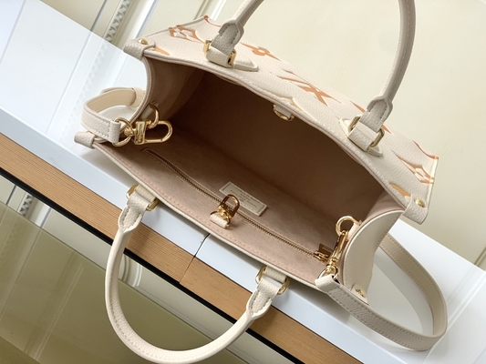 Sahnesafran-riesiges Monogramm OnTheGo Millimeter Louis Vuitton Messenger Bag For Ipad Mini